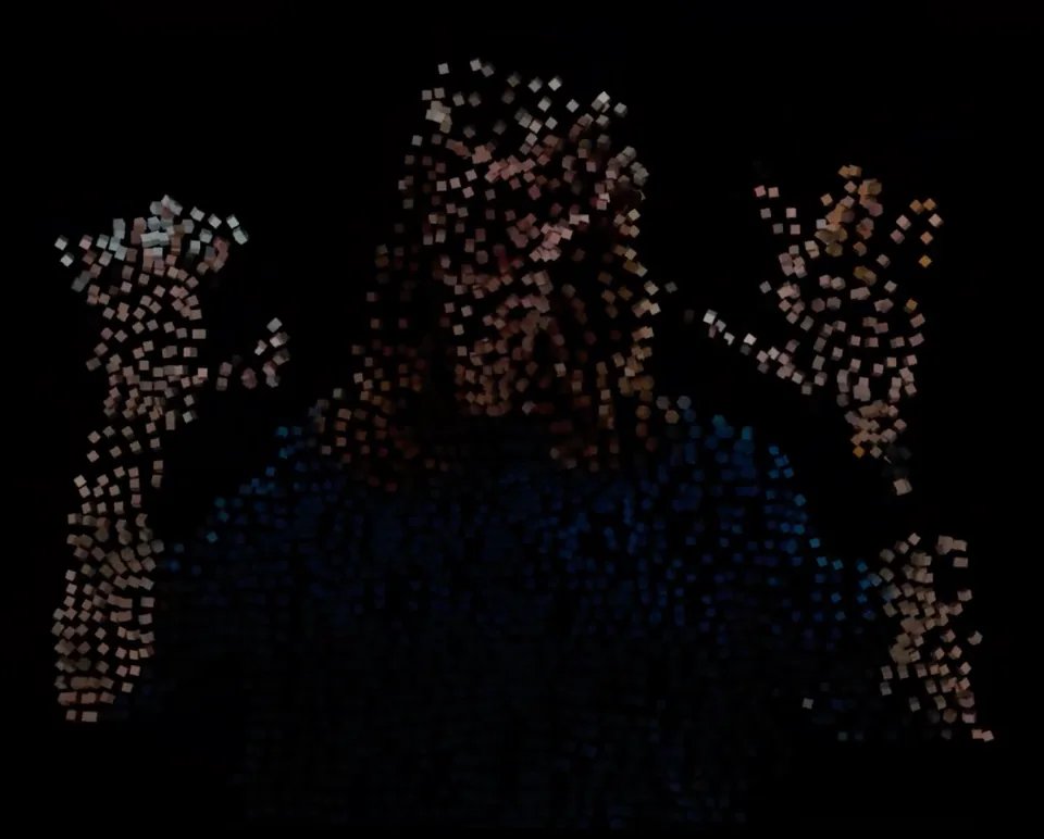 A human-shaped particle cloud, made up of colored cubes, floating over a black background.